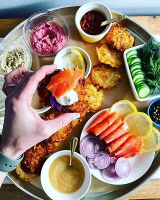 MAKE A LATKE BOARD! 
It’s Day 2 of Chanukah 🕎 and even if you’re not Jewish, I bet you’d enjoy 😋 a crispy Latke with all the trimmings. Am I right?
This board was inspired by a story I recently contributed to for @livestrong_com. As you know, I’m a huge board and #snacktray fan, so I 💙 the idea of a Chanukah-themed board! 
Scroll through to see how I set up this board. A couple of things:
⭐️ Always line your tray with parchment paper, especially if you’re including something fried, like latkes 
⭐️I always thought that 🥔 Latkes had to be served right away. True, they’re amazing right from the pan, but you cook them, place them on paper towels to drain, and then reheat them in the oven at 350 for 8-10 min to cups them up. So you can prep this in advance! 👍
⭐️Since the color of latkes is pretty neutral, I like pairing them up with colorful 🌈 toppings like purple radishes, red 🧅, fresh dill, beet hummus and smoked salmon 🍣 (which also adds protein & omega-3)
Thoughts? LMK if you have any questions on putting your own board together this week😁
#snacktray 
#chanukahparty 
#themedfood 
#latkes 
#latkesfordays 
#latkesandtoppingsgalore 
#latkesandlox 
#applesauce 
#cremefraiche 
#spicyketchup 
#capers 
#babycucumbers 
#smokedsalmon 
#jewishfood 
#tahini